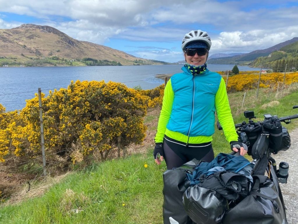 lindsey by a lake while cycling the north coast 500